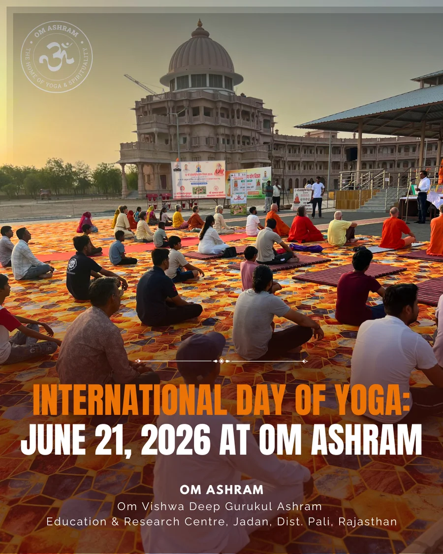 A large crowd of over 200 people practicing yoga in front of the grand Shiva Temple at OM Ashram.